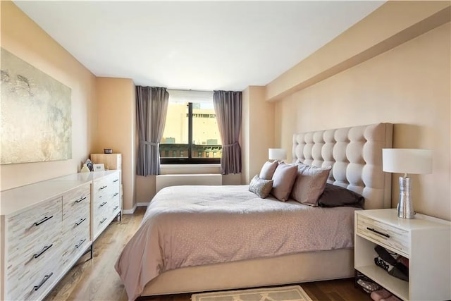 bedroom featuring hardwood / wood-style floors