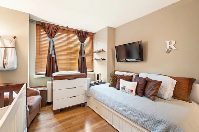 bedroom with light hardwood / wood-style flooring