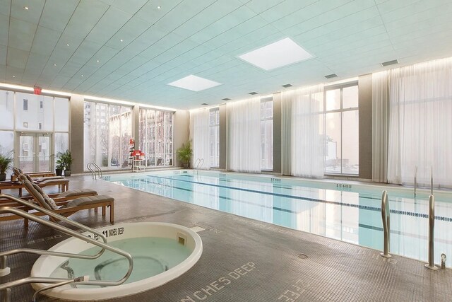 view of pool featuring a skylight