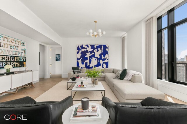 living room featuring parquet flooring and a chandelier