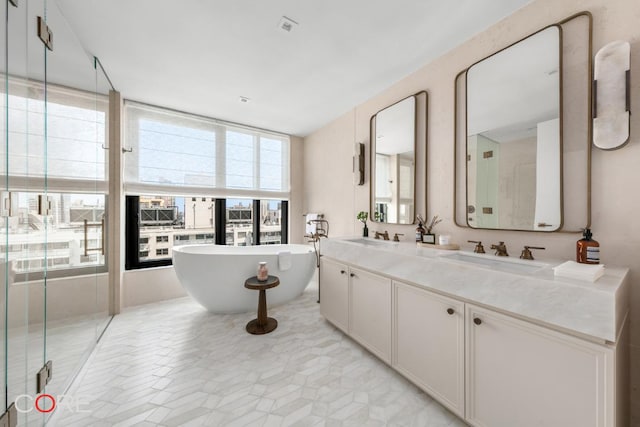 bathroom featuring vanity and separate shower and tub