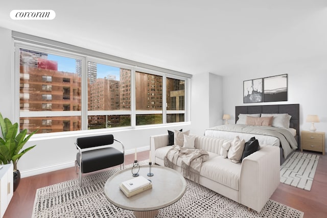 200 E 94th St Unit 603, New York City, NY 10128 - bedroom with wood finished floors and a city view