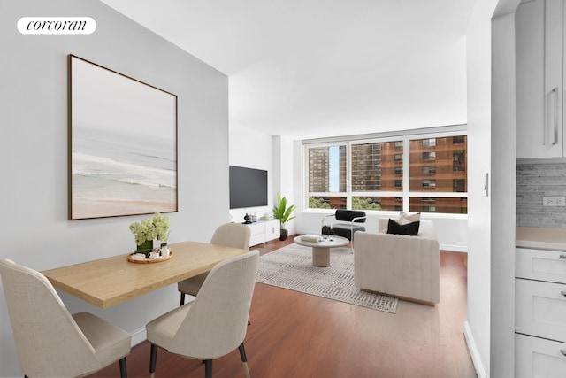 dining space featuring hardwood / wood-style flooring