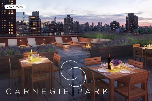 200 E 94th St Unit 603, New York City, NY 10128 - patio terrace at dusk featuring outdoor dining space, a patio area, a fire pit, and a skyline view