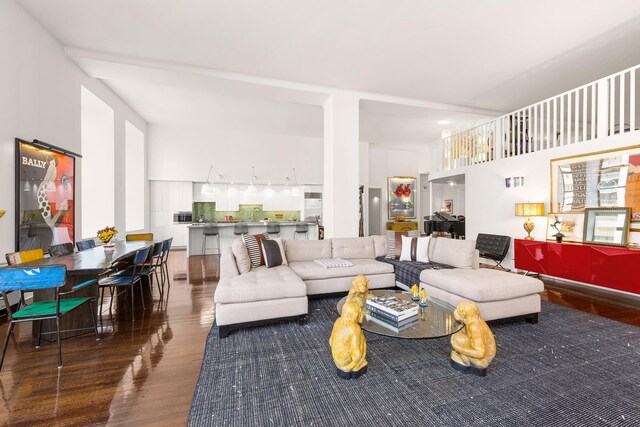 living room with dark hardwood / wood-style flooring