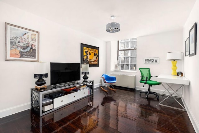 office space featuring dark hardwood / wood-style floors and radiator