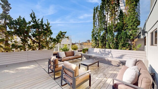 wooden deck featuring an outdoor living space