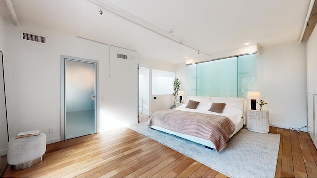 bedroom featuring hardwood / wood-style floors