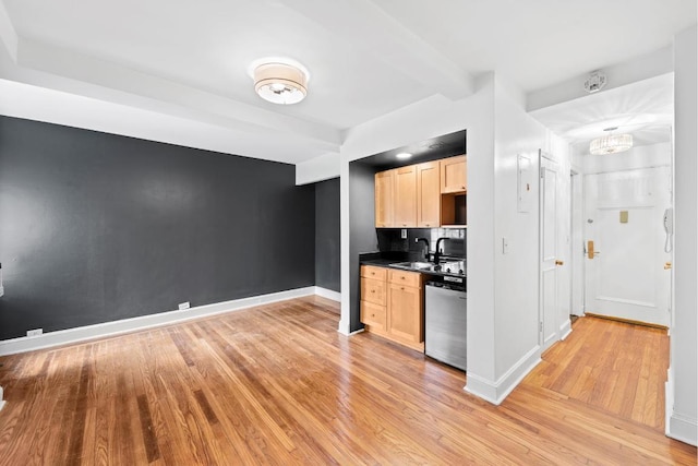 kitchen featuring dishwasher, sink, light brown cabinets, and light hardwood / wood-style flooring