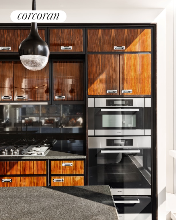 kitchen with tasteful backsplash and appliances with stainless steel finishes