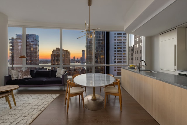 dining area with dark wood-type flooring, a healthy amount of sunlight, and floor to ceiling windows