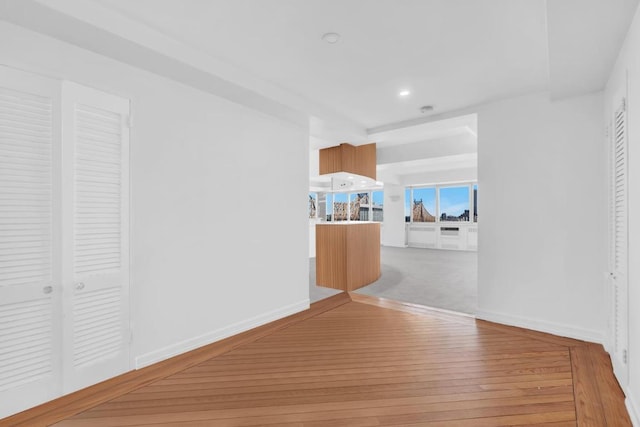 corridor featuring light hardwood / wood-style floors