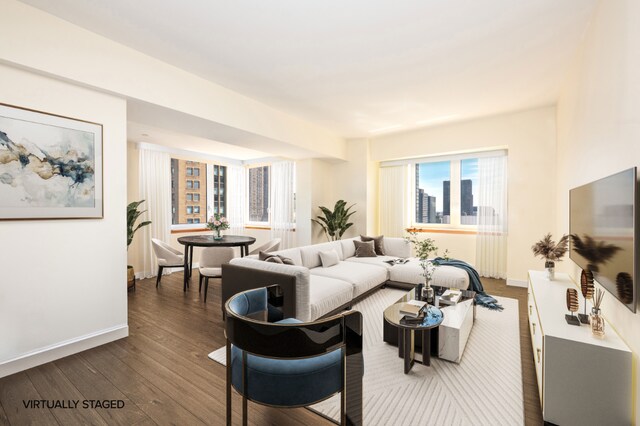 living room with dark hardwood / wood-style flooring