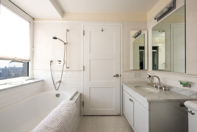 full bathroom featuring vanity, tiled shower / bath combo, tile patterned floors, and toilet