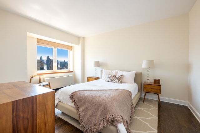 bedroom featuring dark hardwood / wood-style floors and radiator