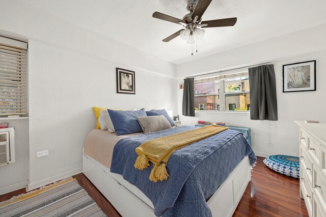 bedroom with ceiling fan and dark hardwood / wood-style flooring