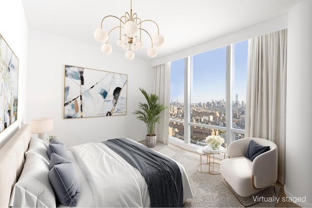 bedroom featuring expansive windows, a chandelier, and carpet