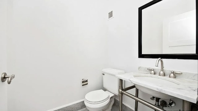 bathroom with sink and toilet