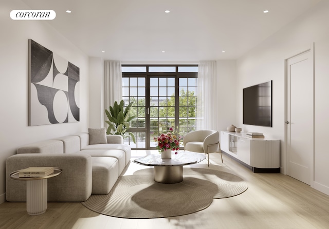 living room featuring floor to ceiling windows and light wood-type flooring