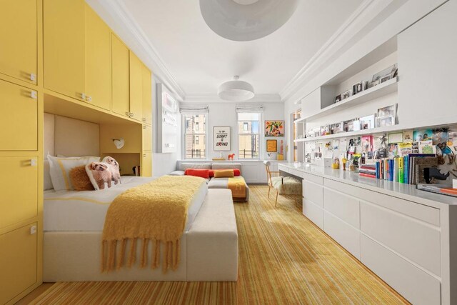 bedroom featuring crown molding