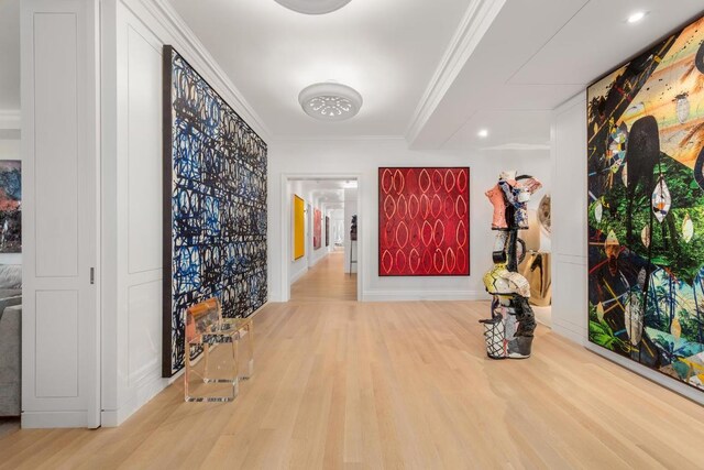 hall featuring crown molding and hardwood / wood-style flooring