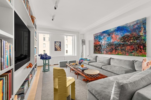 living room featuring crown molding