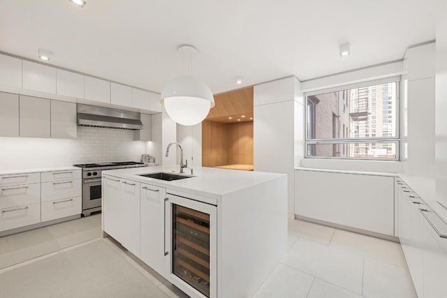 kitchen with white cabinetry, sink, and wine cooler