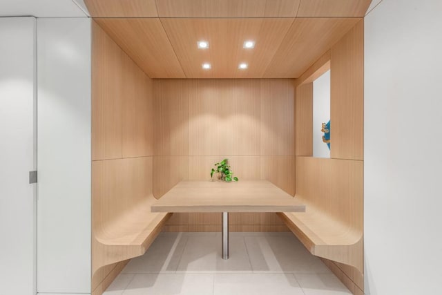 view of sauna / steam room with light tile patterned flooring and wooden ceiling