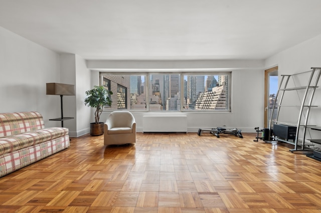 unfurnished living room featuring light parquet flooring and a healthy amount of sunlight