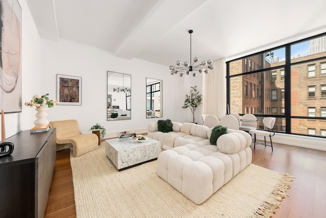 living room featuring a chandelier and wood finished floors