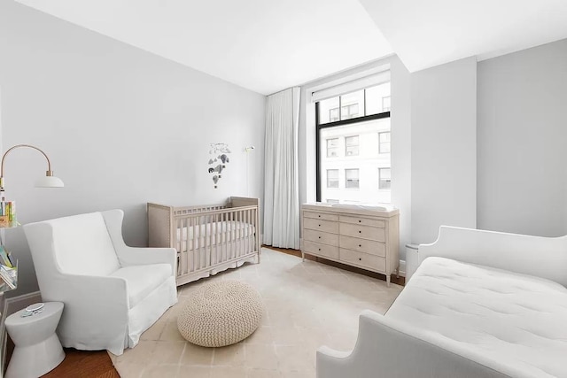 bedroom featuring a crib