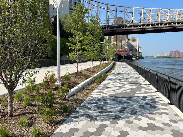 exterior space with a water view and a view of city