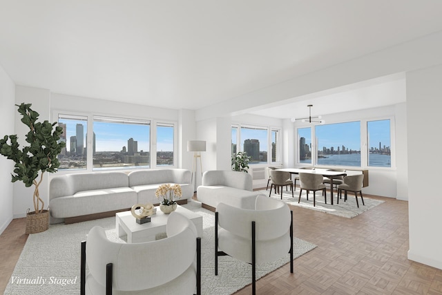 living room featuring baseboards and a city view