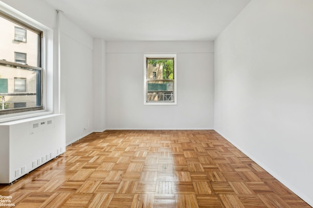 1 Fordham Hill Oval Unit 1E, New York City, NY 10468 - spare room featuring radiator and baseboards
