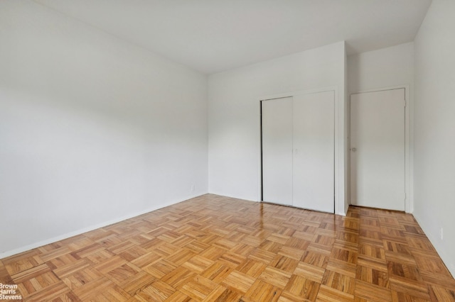 unfurnished bedroom featuring light parquet floors