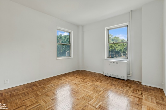 1 Fordham Hill Oval Unit 1E, New York City, NY 10468 - spare room featuring radiator heating unit and baseboards
