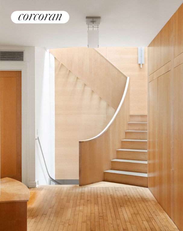 stairs with wood walls