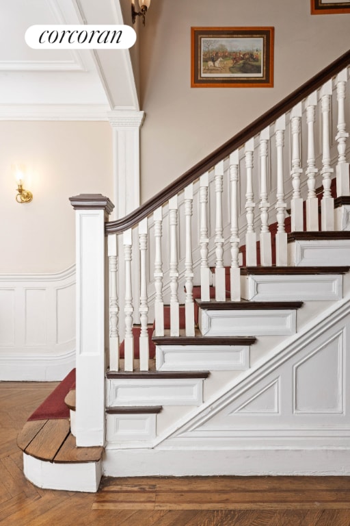 staircase with hardwood / wood-style flooring