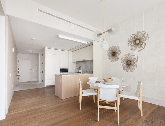 dining room with light hardwood / wood-style floors