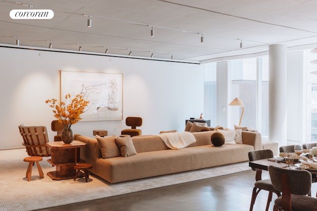 100 E 53rd St Unit 8C, New York City, NY 10022 - living area featuring rail lighting and finished concrete flooring