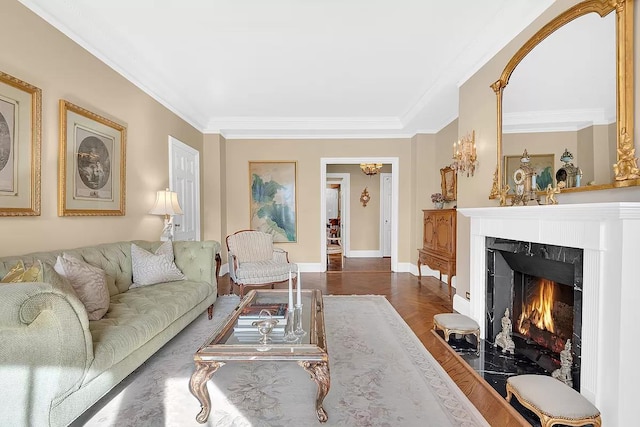 living room featuring ornamental molding, dark wood finished floors, a fireplace, and baseboards