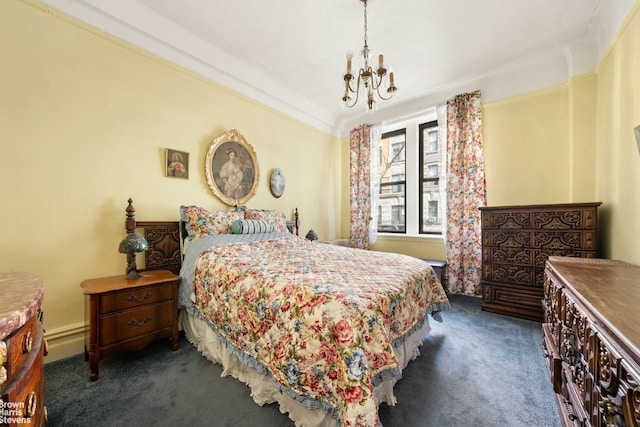 bedroom featuring an inviting chandelier, crown molding, and dark colored carpet