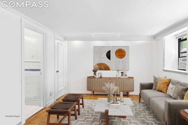 living room with ornamental molding and parquet floors