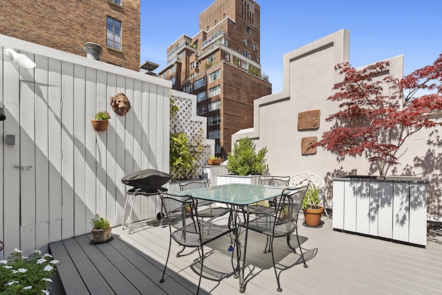 wooden deck with outdoor dining area