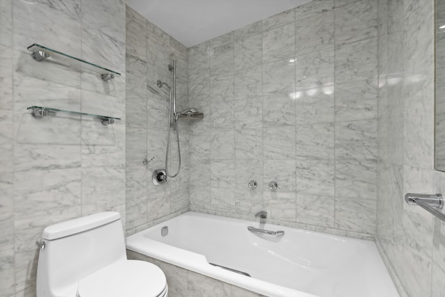 full bathroom featuring toilet, tile walls, and tiled shower / bath