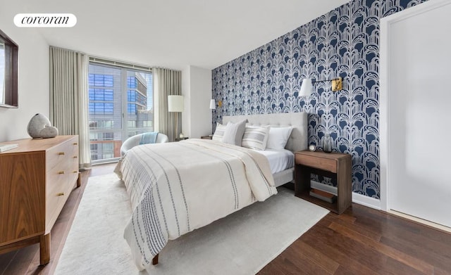 bedroom with hardwood / wood-style floors