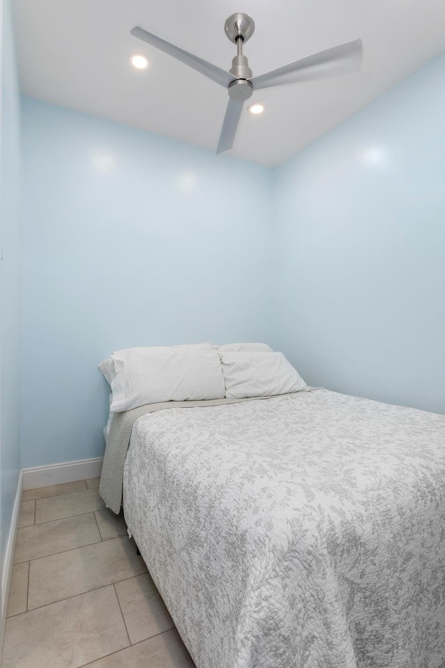 bedroom with light tile patterned floors, ceiling fan, baseboards, and recessed lighting