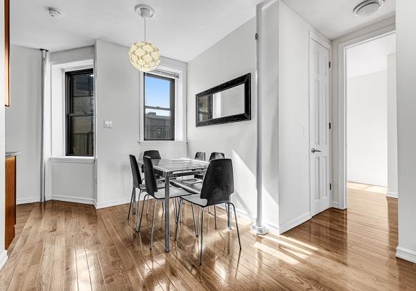 dining space with hardwood / wood-style flooring