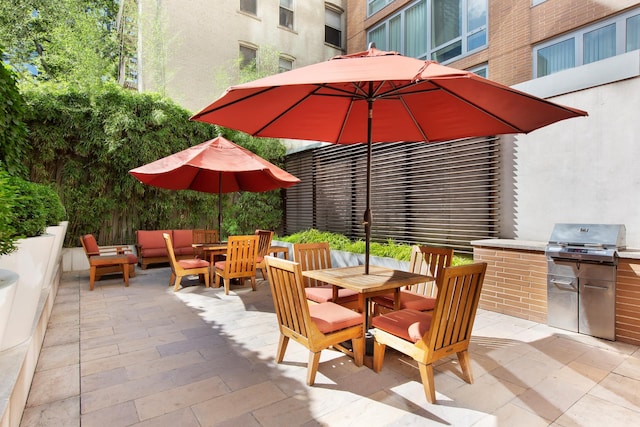 view of patio / terrace with grilling area, an outdoor hangout area, outdoor dining area, and area for grilling