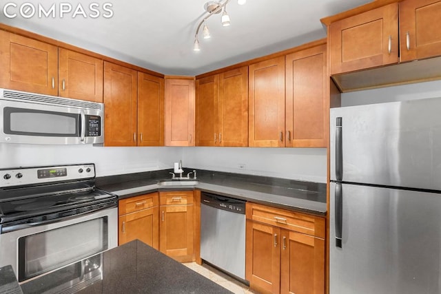 kitchen featuring appliances with stainless steel finishes and sink